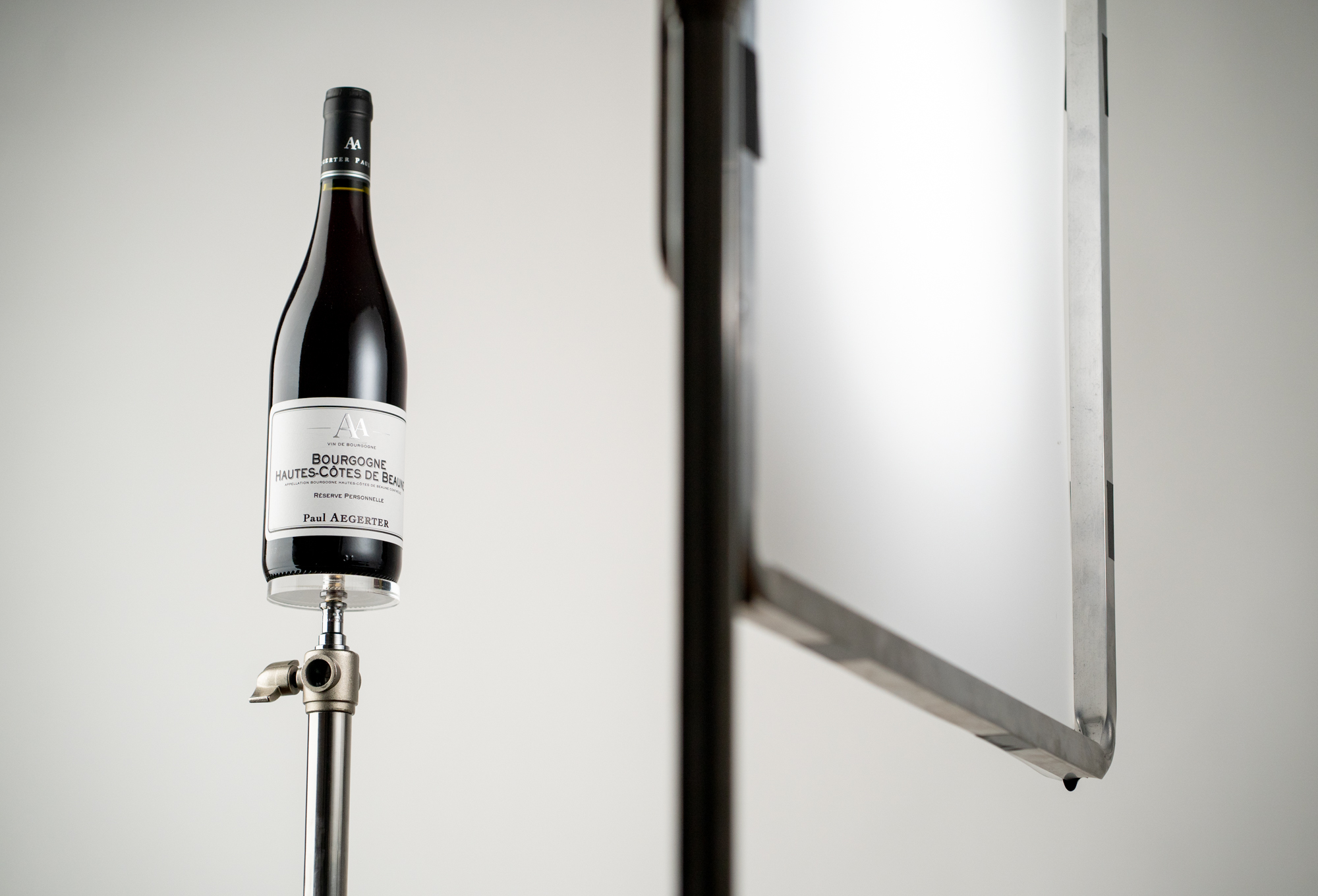 Photographie backstage studio mise au point bouteille de vin
