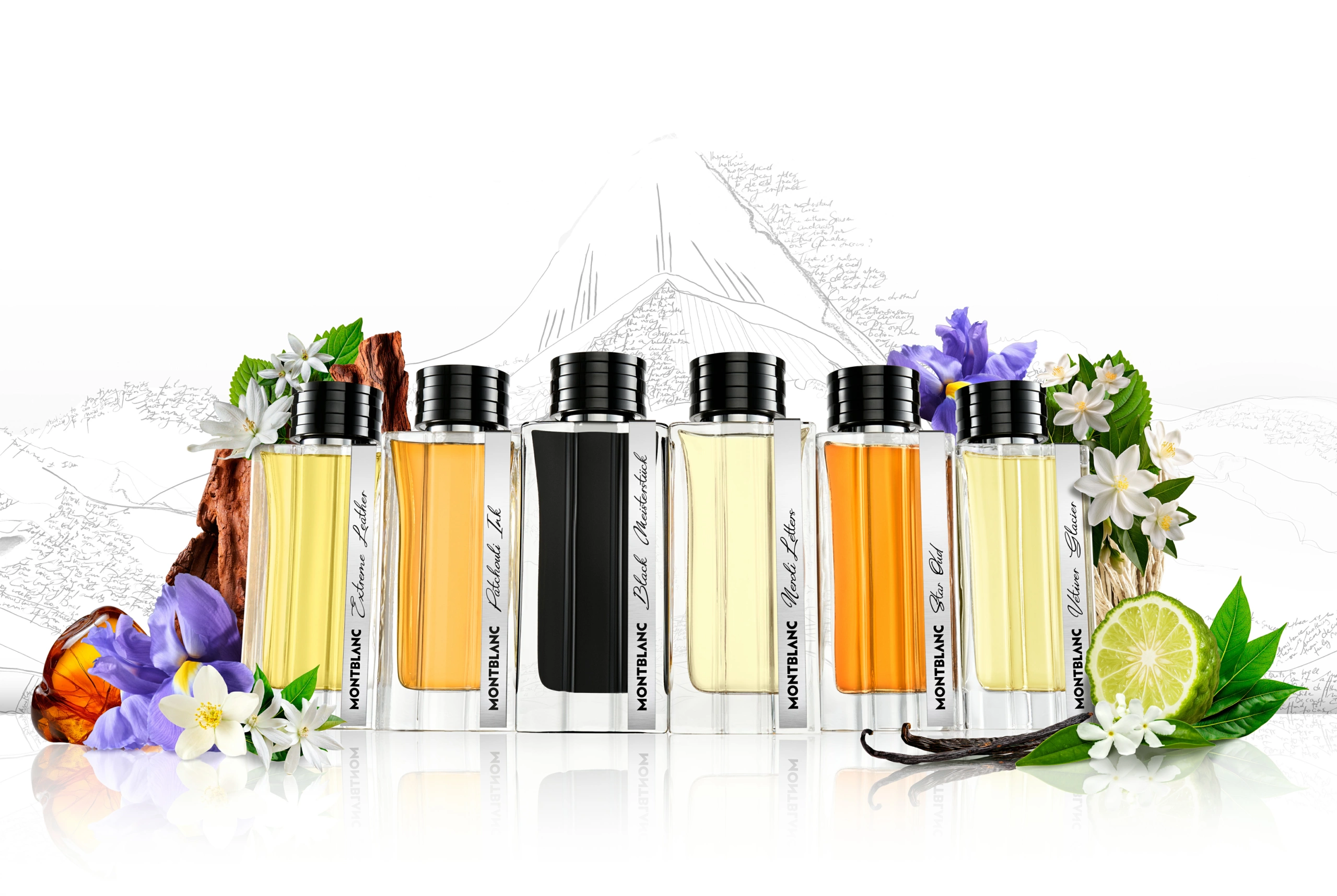 KV_01_MONTBLANC_DEF Une rangée de six flacons de parfum Montblanc, chacun contenant un liquide d’une couleur distincte, disposés sur une table et entourés de fleurs, de feuilles, de tranches de citron vert et de pierres d’ambre. La composition comprend une illustration discrète représentant une montagne en arrière-plan ; un éclairage de studio a été utilisé pour garantir une exposition homogène et des détails nets.